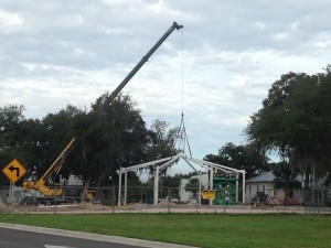 The framework for the playground shade goes into place.